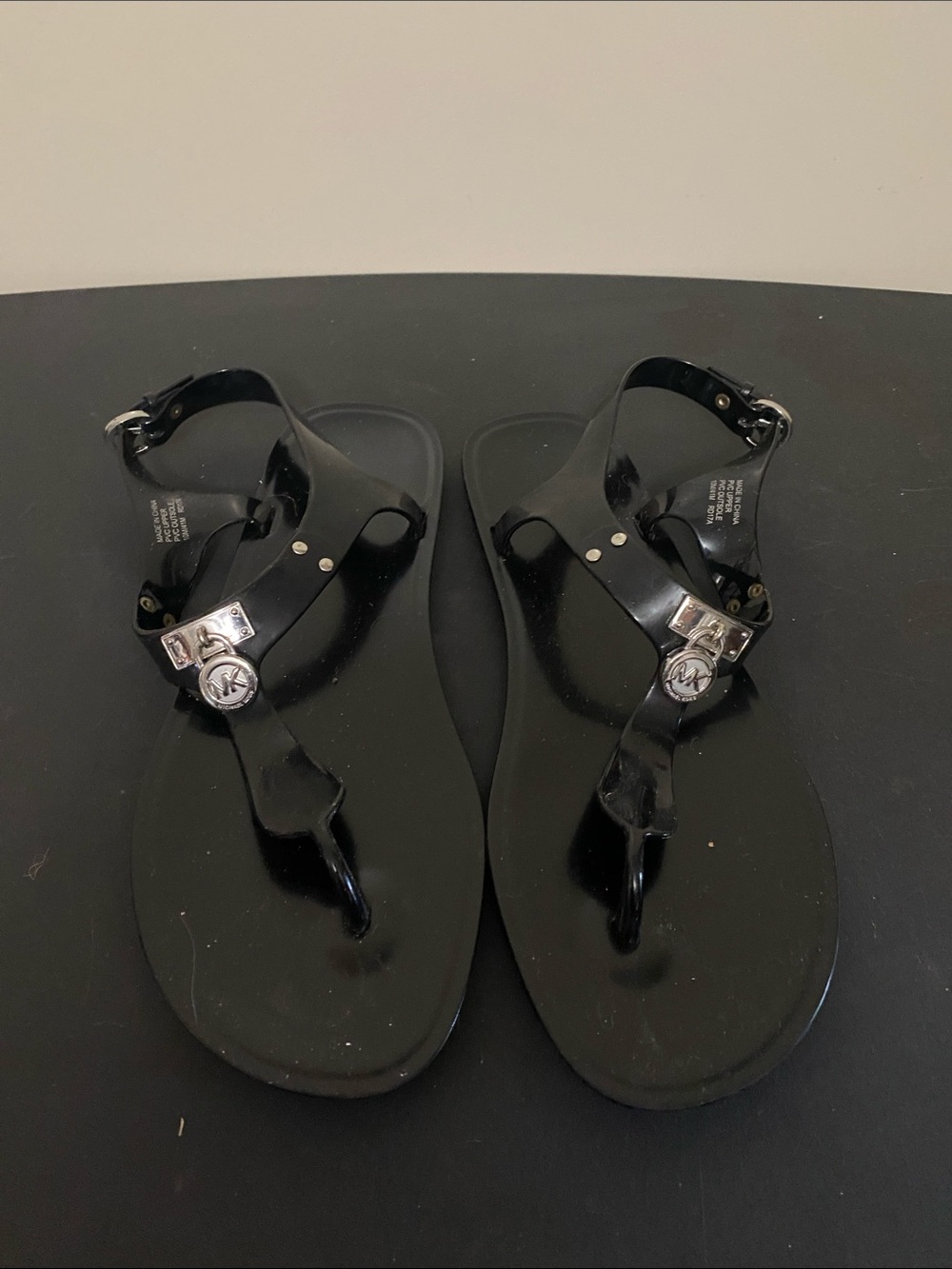 Michael Kors Black Jelly T-Strap Sandals with MK Silver Accent